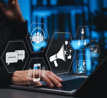 Digital Marketing Concept. Social Media Marketing, Communication icons, social media advertising, audience targeting, analytics, and promotion, Person using laptop to manage online marketing campaigns