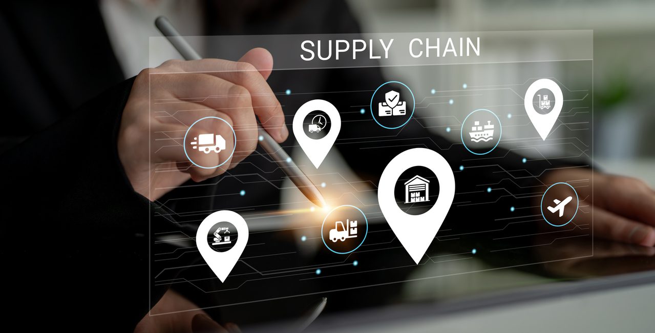 A business professional examines supply chain dynamics using advanced technology, focusing on logistics and strategy to optimize efficiency and improve service delivery. Ledger