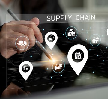 A business professional examines supply chain dynamics using advanced technology, focusing on logistics and strategy to optimize efficiency and improve service delivery. Ledger