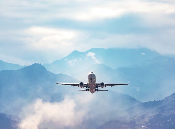 Stock plane flying through mountains